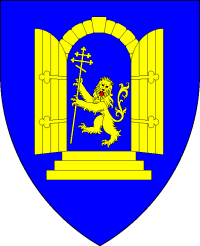 Device: Azure, a lion rampant guardant, maintaining a patriarchal crosier, within a stooped arch, doors open, all Or.
(Yet to be added maintaining a compass star argent, Heraldic Supporters a Dragon and a Griffin)