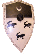 Device: In chief a Cresent incresent on Sable.
In base, three wolves sable stantant, two and one, on argent